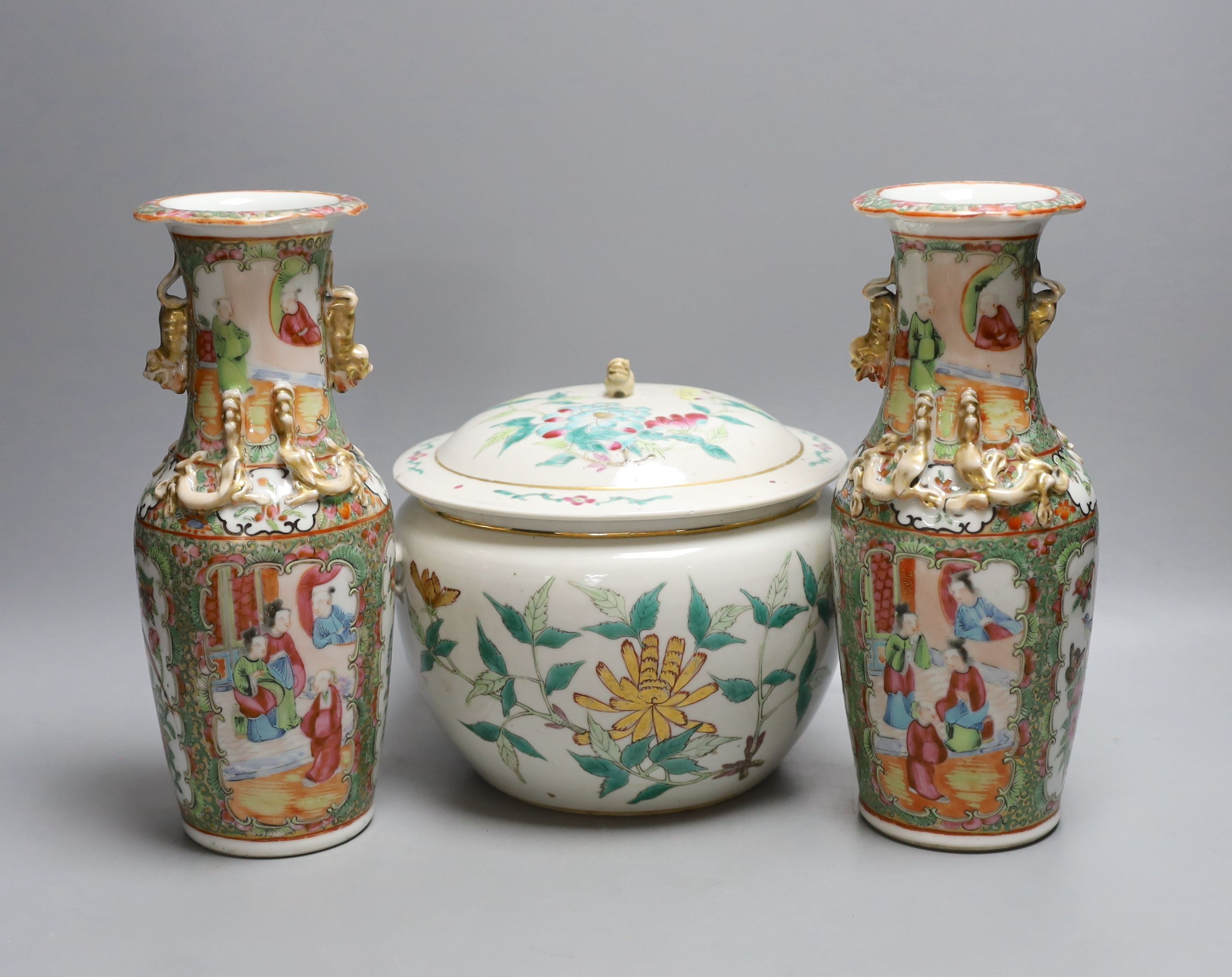 A pair of 19th century famille rose vases, 25cm tall, together with an early 20th century Chinese kamcheng (3)